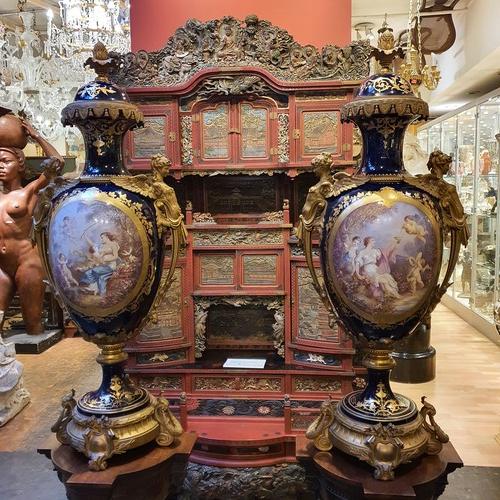 A very large pair of gilt-bronze mounted sevres vases. Napoleon III period. signed Poitevin